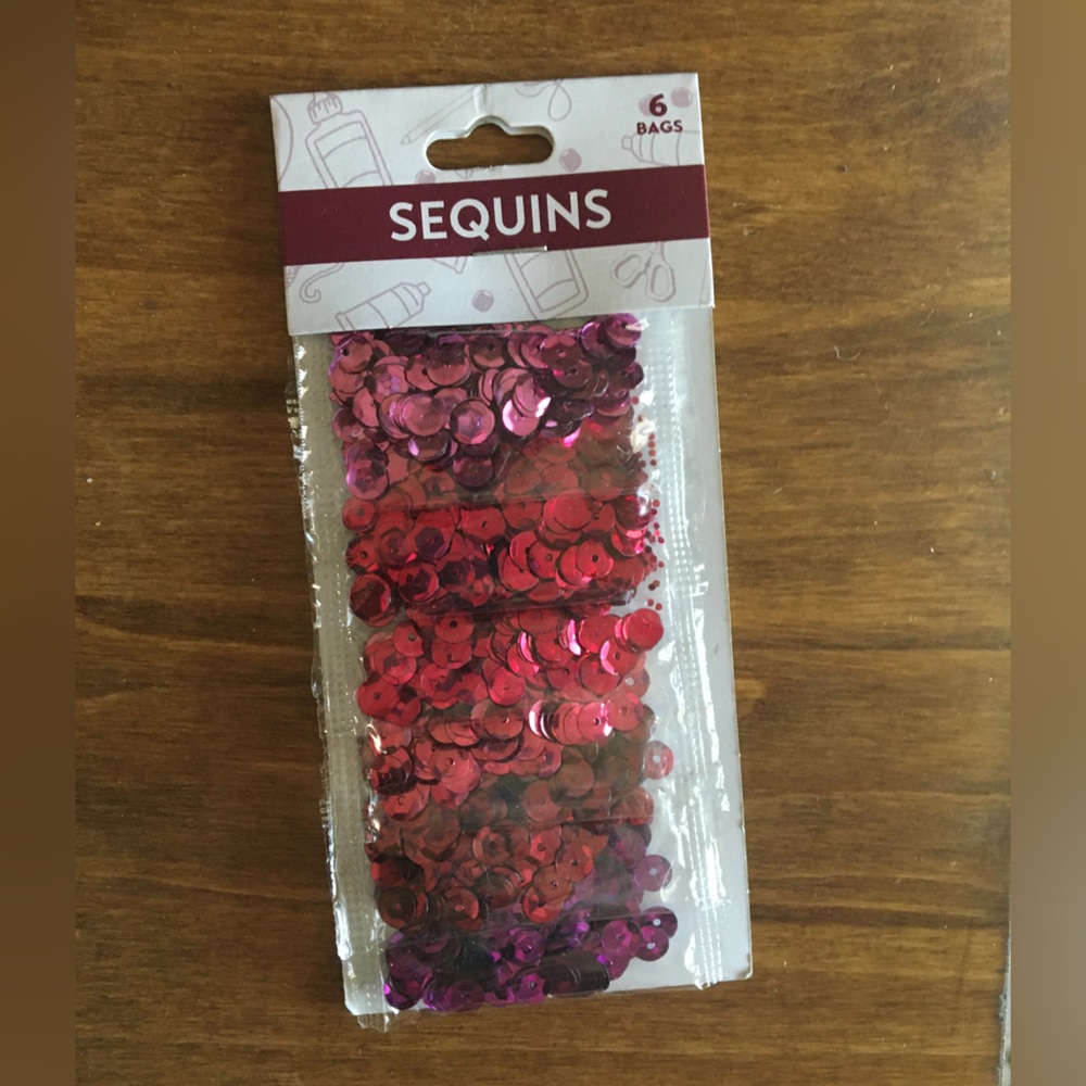 Shades of pink sequins. Unopened.